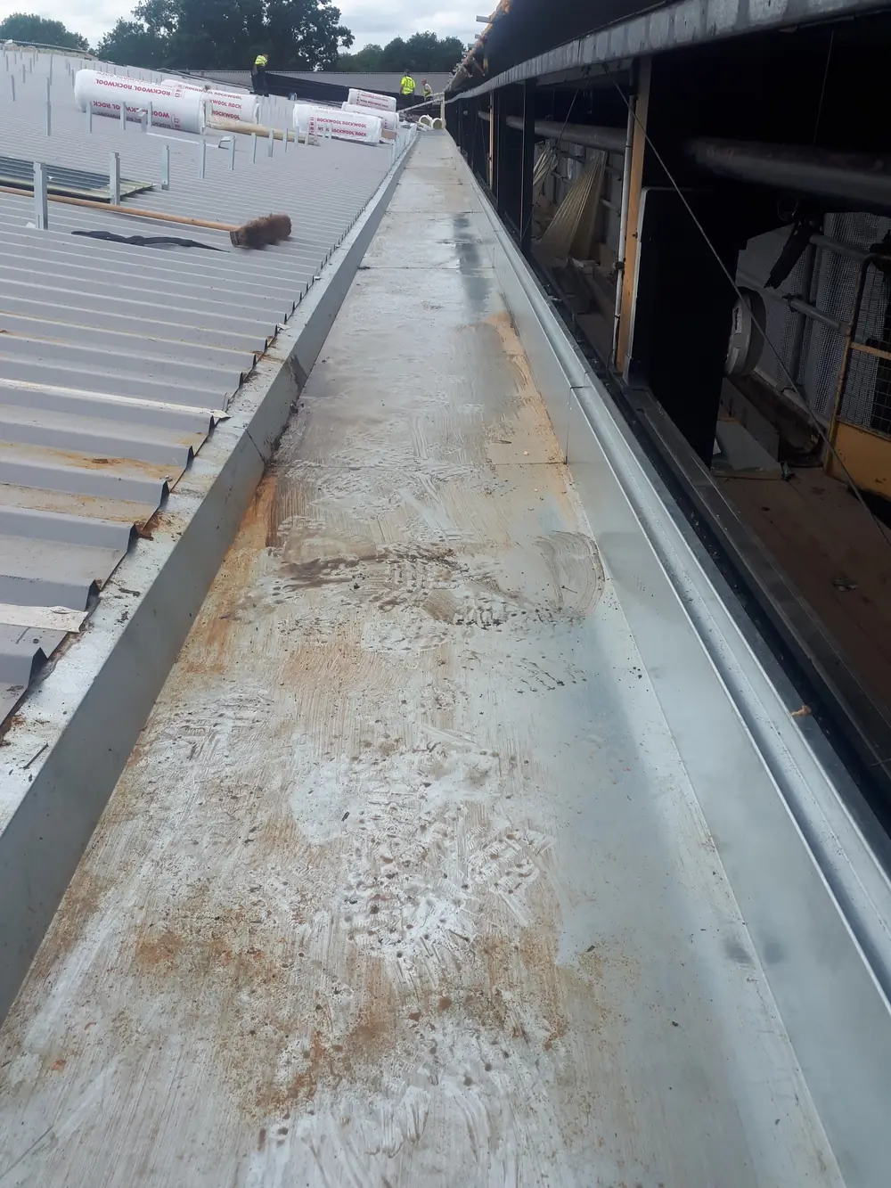 Worn valley gutter before refurbishment
