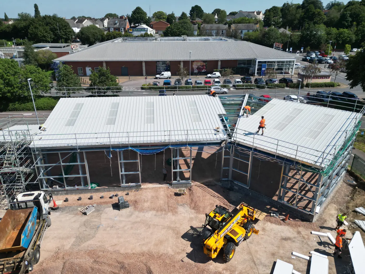 Roof panels going on the new retail building