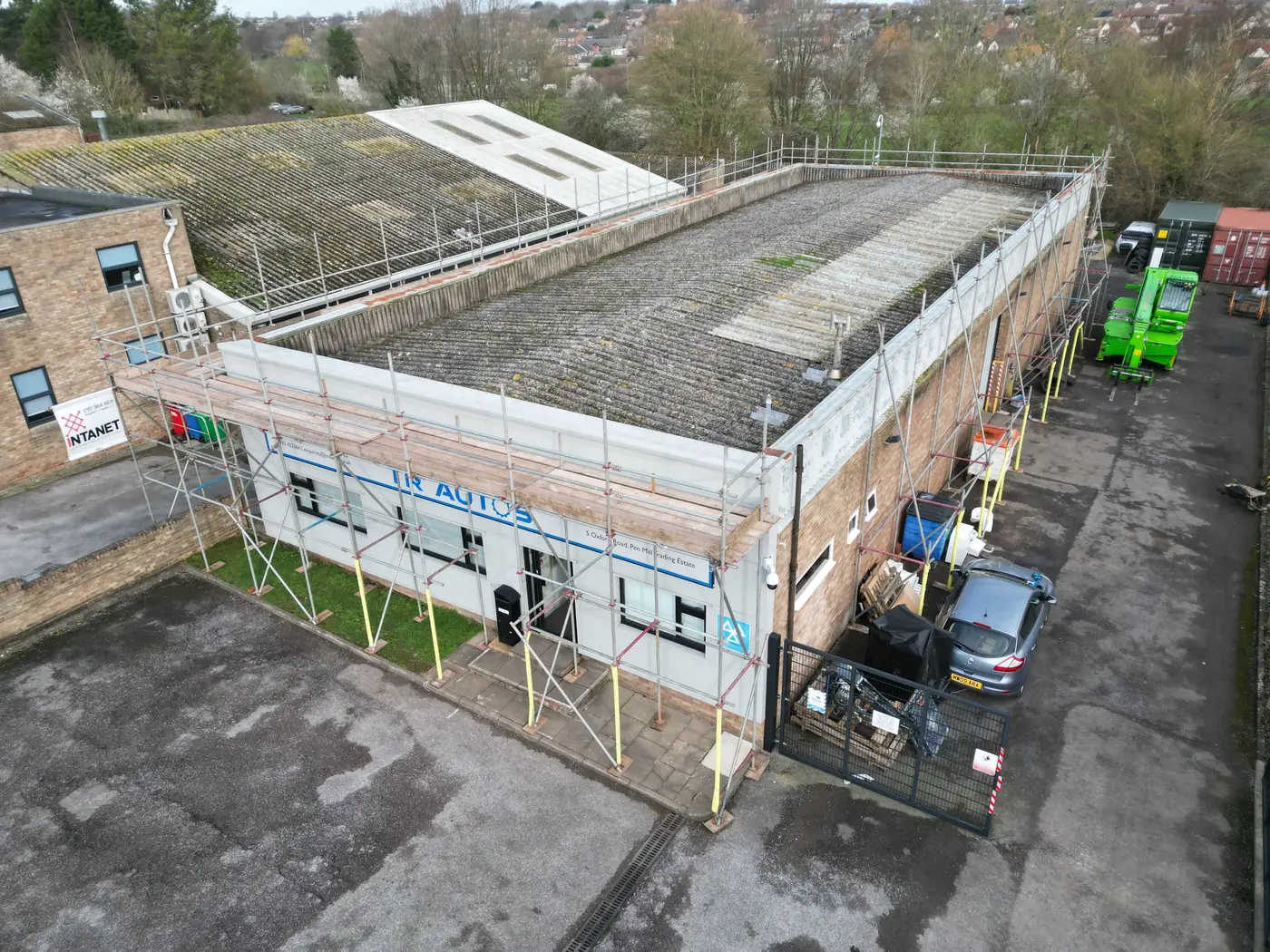 Aerial view of the old roof and parapet before work began